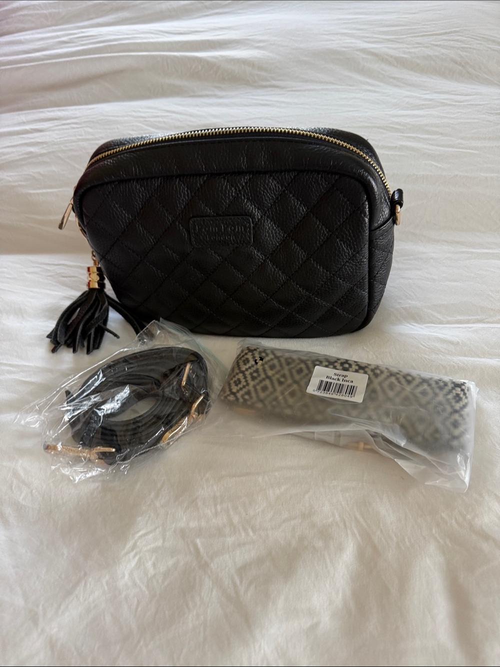 Pom Pom London mini Quilted Black Crossbody Bag with Tassel Accent